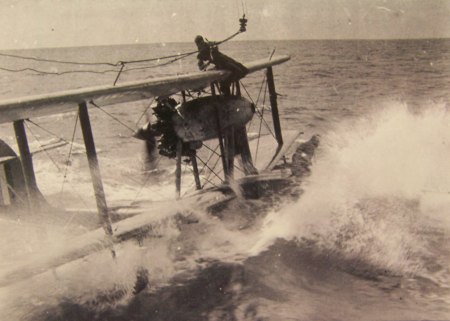 Crew recovering the Walrus aircraft beside HMAS Sydney.